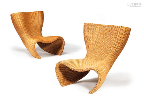 Woven cane, powder-coated and polished tubular steel with manufacturer's label67cm x 87cm x 76cm  Marc Newson (Australian, b. 1963) A pair of Wicker chairs designed c.1990 for IDÉE, Japan