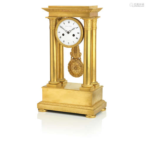 The dial inscribed 'Gabrield le Roy, a Paris'  A late 19th gilt metal portico clock