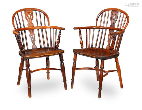 One with the stamp of William Wheatland of Rockley, Nottinghamshire (fl.1822-28) A near-pair of George IV yew, elm, beech and ash low-back Windsor armchairs