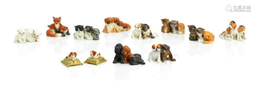 Circa 1930s A collection of Royal Worcester miniature cat and dog groups by Doris Lindner