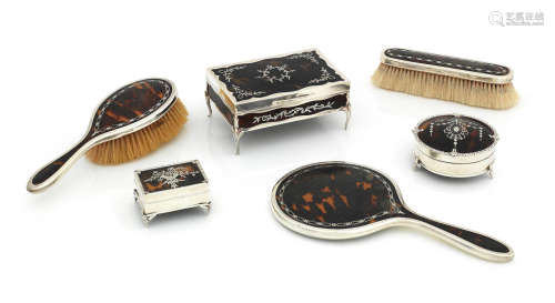 various makers and dates to include William Comyns, Birmingham 1907  (9) A group of tortoiseshell mounted dressing table items