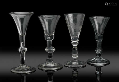 Circa 1730-40  A light baluster wine glass, two baluster wine glasses and a 'Williamite' wine glass