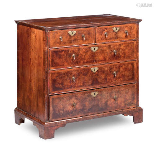 A George II and later walnut and featherbanded chest of drawers