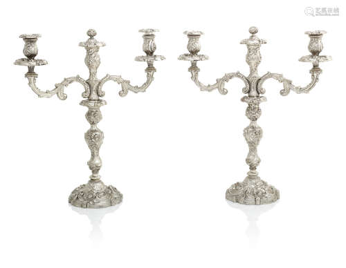 the bases by Waterhouse, Hodson & Co, Sheffield 1826, the arms by Samuel Walker & Co, Sheffield 1837  A composite pair of George IV/Victorian three-light silver candelabra