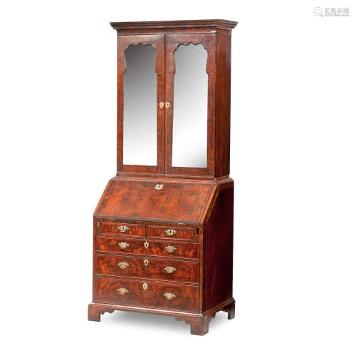 A Queen Anne and later walnut featherbanded bureau cabinet