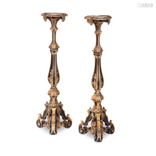 A pair of 19th century North Italian painted and giltwood torcheres