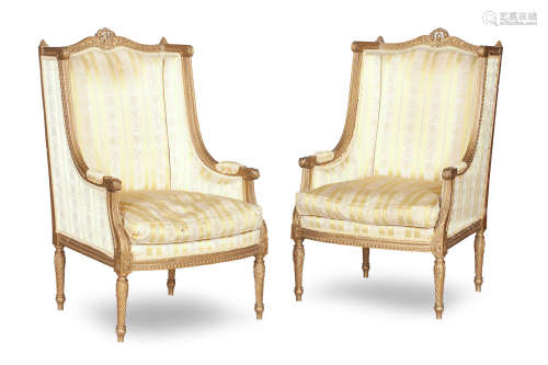 A pair of French late 19th/early 20th century gilt painted arm chairs