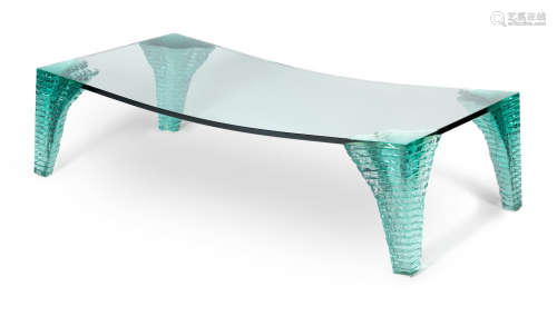 Glass, concave top, stacked legs140cm x 70cm x 38cm  Danny Lane (American, b. 1955) An Atlas coffee table, manufactured by Fiam