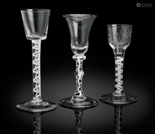 Circa 1760 and one dated 1802 Three various opaque twist glasses