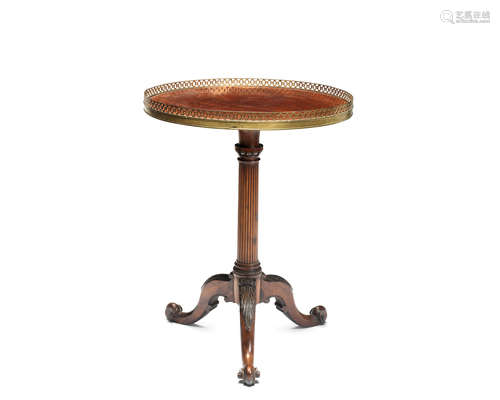 A 19th century George III style carved mahogany tripod table