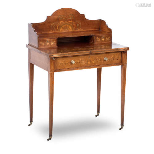 An early 20th century satinwood and marquetry inlaid Sheraton Revival writing table