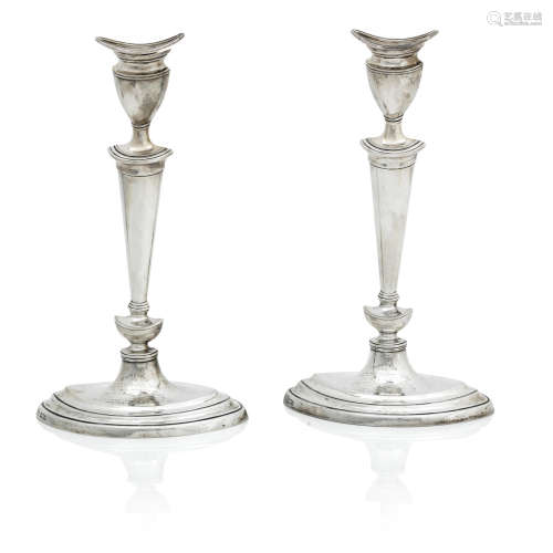 by Goldsmiths & Silversmiths Company, London 1905  A pair of early 20th century silver candlesticks
