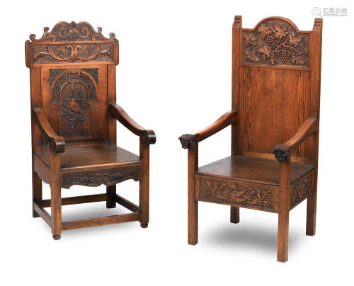 Two late 19th century oak two panel backed arm chairs