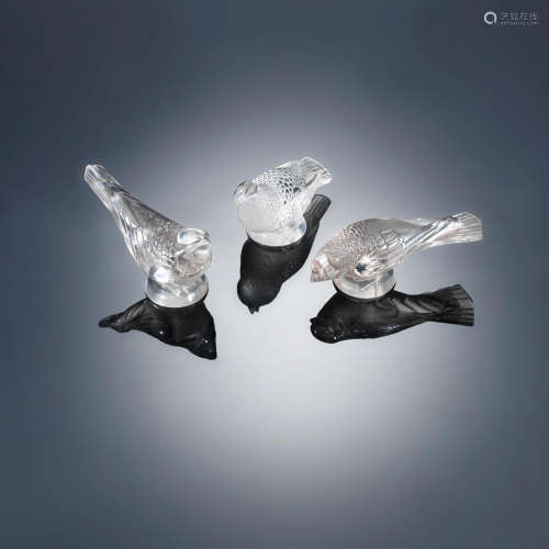 Three 'Chardonneret' Paperweights: 'Timide', 'Hardi' and Moqueur', designed in 1931 René Lalique (French, 1860-1945)