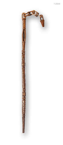 An 18th century carved boxwood implement with integral chain, possibly a distaff