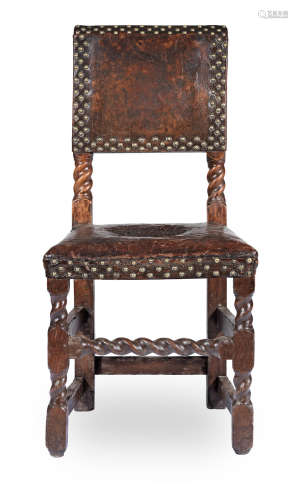 A Charles II joined beech and hide-upholstered backstool, circa 1670