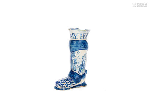An exceptional early London delftware drinking cup in the shape of a boot, circa 1650
