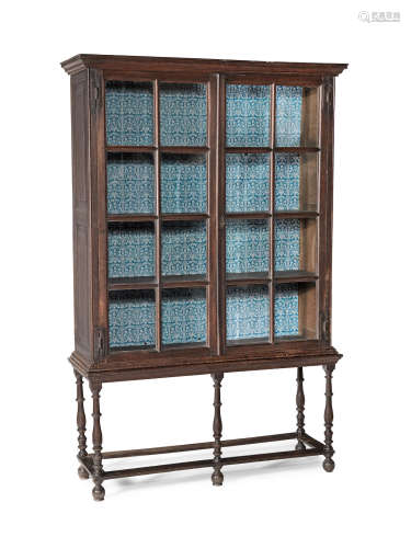 A rare William & Mary joined oak and glazed bookcase or display case on stand, circa 1690