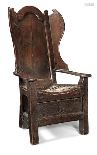 A George II joined oak 'lambing-type' wing armchair, Yorkshire or Lancashire, circa 1740