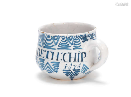 A London delftware caudle cup, dated 1676