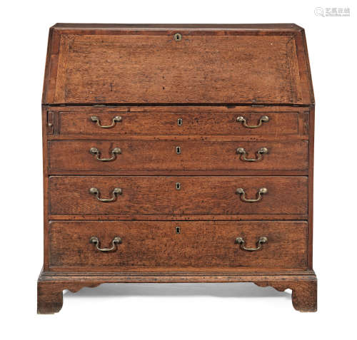 A George III oak and mahogany crossbanded bureau, circa 1780