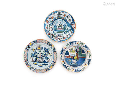 Three London delftware large plates, circa 1740 and 1780