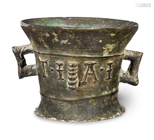 An unusual 17th century twin-handled leaded bronze mortar, with partial 17th century date