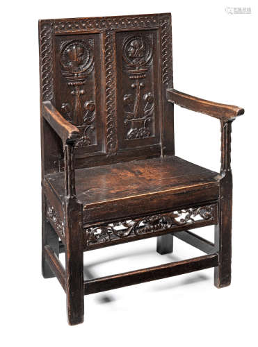 An exceedingly rare Henry VII joined oak double panel-back armchair, circa 1530