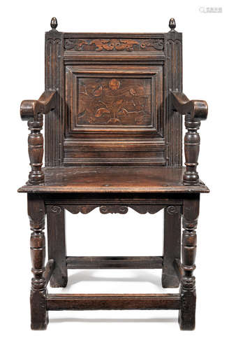 A Charles I joined oak and inlaid panel-back open armchair, Taunton, Somerset, circa 1640