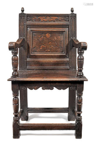 A Charles I joined oak and inlaid panel-back open armchair, Taunton, Somerset, circa 1640