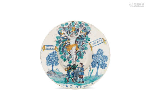 A Central European faience charger, dated 1680