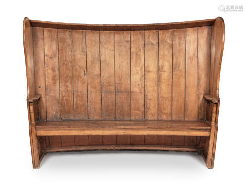 An impressive George III fruitwood and elm boarded high-back bowed canopy settle, West Country, circa 1800