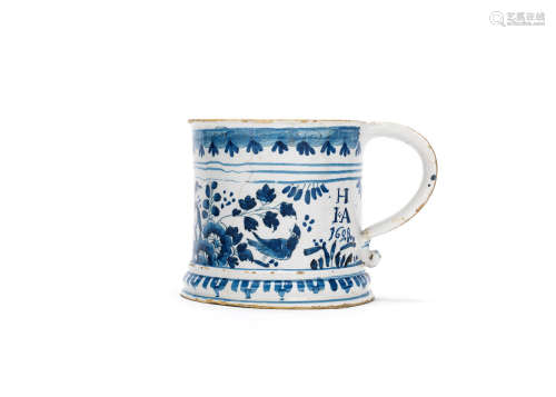 An impressive English delftware porter mug, dated 1698