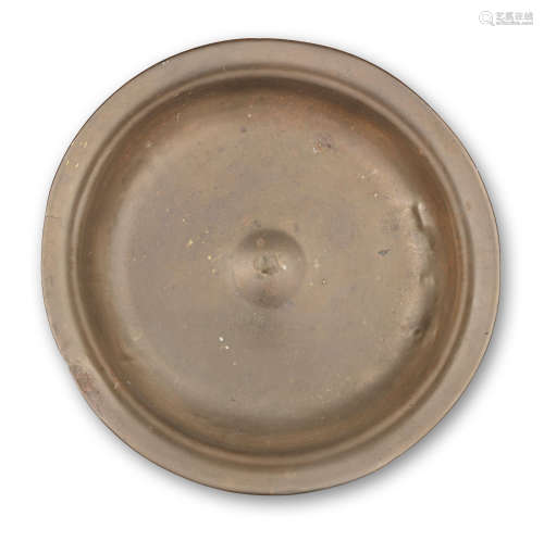 A large brass alloy bowl