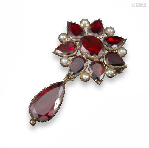 A George III garnet and pearl-mounted gold flower head brooch, suspending a pear-shaped garnet, 5.