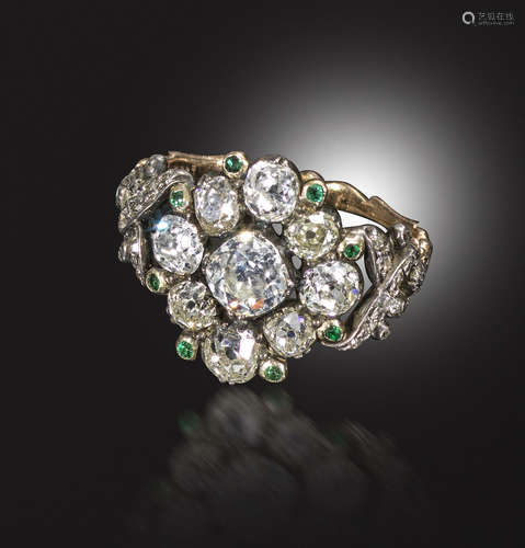 A George III diamond and emerald cluster ring, centred with a cushion-shaped diamond within a