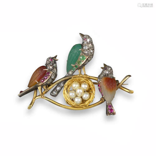 An early 20th century gold brooch, designed as three birds and a nest with eggs, two birds with