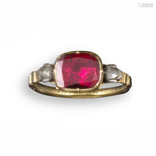 An early 18th century English gold memorial ring, set with a flat oval garnet and two pear-shaped