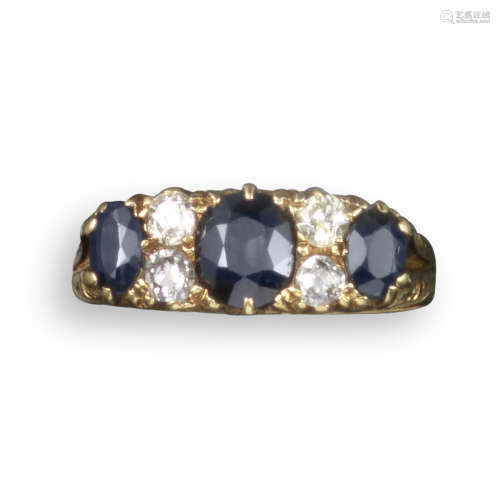 A Victorian sapphire and diamond half-hoop ring, set with three graduated oval-shaped sapphires