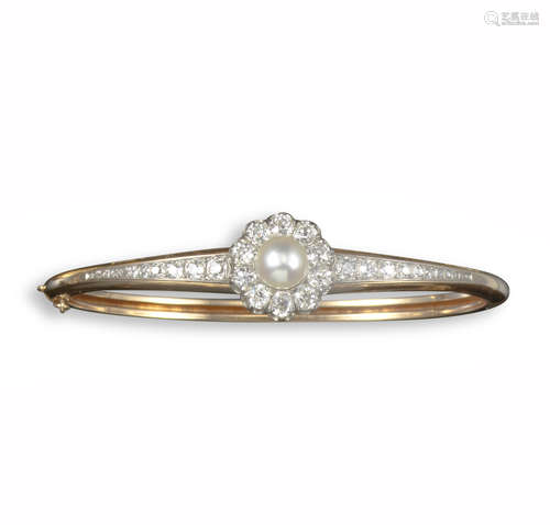 A 19th century pearl and diamond bangle, centred with a natural pearl within a border of old