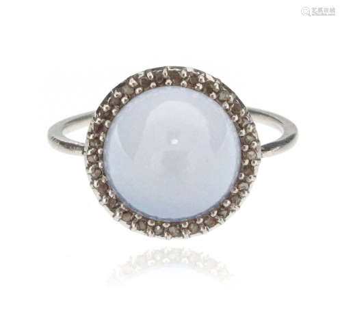 A sugarloaf-shaped chalcedony ring, set within a surround of rose-cut diamonds in white gold, size