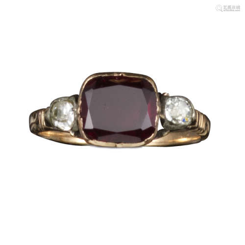 A George III garnet and diamond ring, the flat garnet flanked with cushion-shaped diamonds in silver