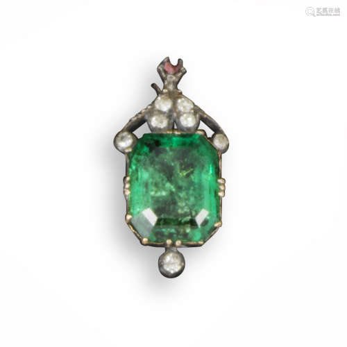 An emerald and diamond-set pendant, the emerald-cut emerald is set in a closed-back mount with small