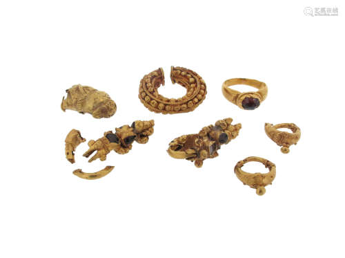 A faceted red stone-mounted gold ring in the classical manner, with case, and various gold items and