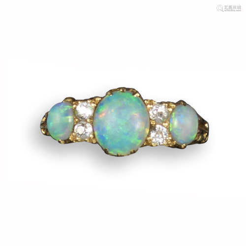An opal and diamond seven-stone half-hoop ring, in yellow gold with scroll pierced shoulders, size
