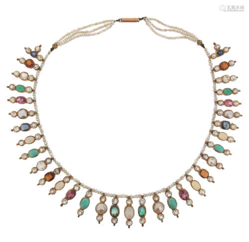 A seed pearl fringe necklace, suspending tassels set with white stones, turquoise, emeralds,