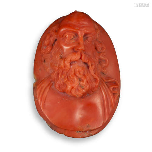 A 17th/18th century carved coral cameo, depicting the full face of a bearded man, probably a