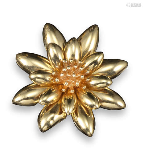 A yellow gold flower head brooch by Cartier, of stylised form, signed to reverse and stamped 14ct,