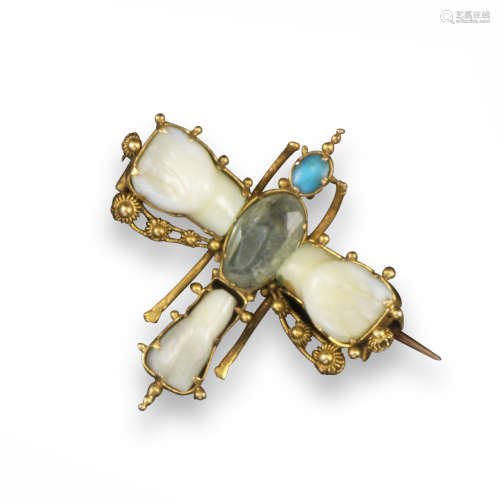 An early 19th century butterfly brooch, the wings and tail formed from teeth, the body set with a