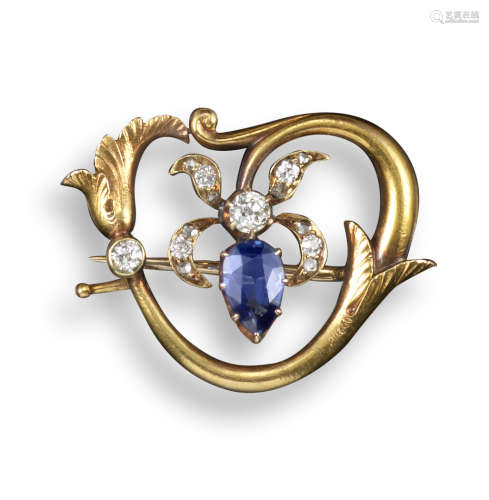 A sapphire and diamond-set Art Nouveau floral brooch by Fabergé, set with a pear-shaped sapphire and